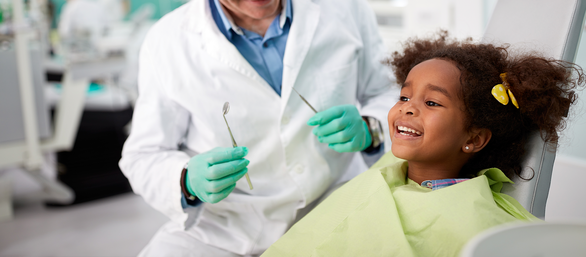 Dentist working on a little girl's teeth